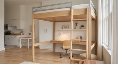 Loft bed with a desk and chair underneath in a tiny studio apartment to save floor space